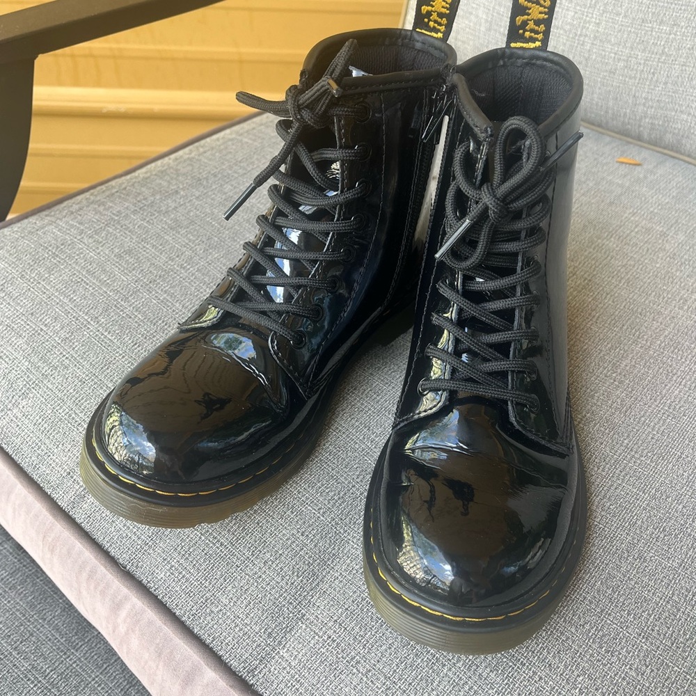 Dr Martens black patent leather boot.